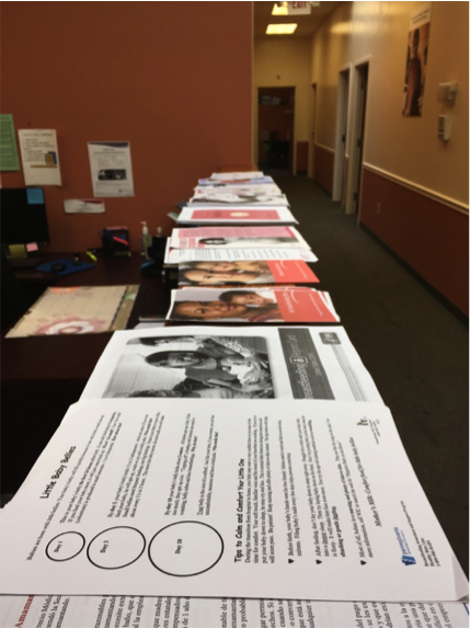 In preparation for the training sessions, stacks of handouts were lined up for the breastfeeding peer counselors.